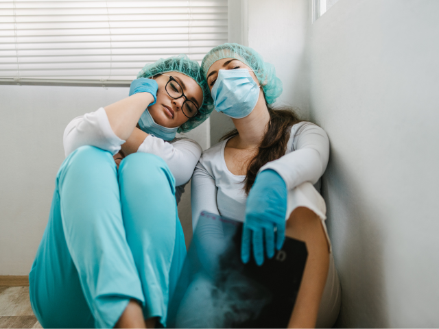 tired nurses sleeping on the floor