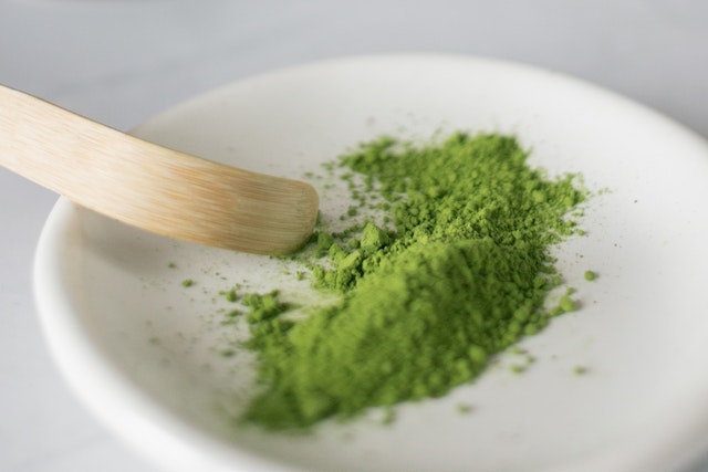 kratom powser on a shallow ceramic bowl