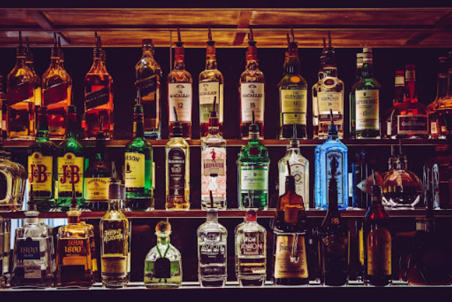 display shelf of different types of alcohol