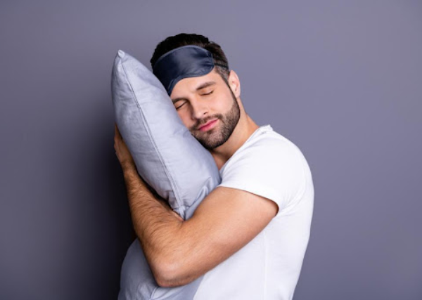 a guy sleeping - head on a pillow